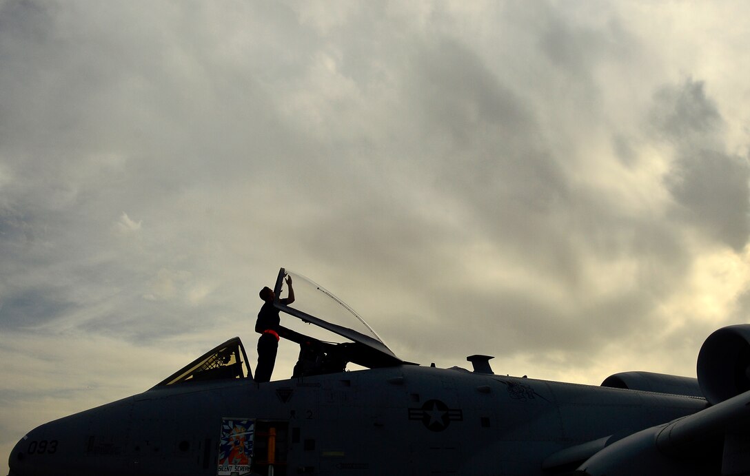 Senior Airman Curtis Mitchell, 455th Expeditionary Aircraft Maintenance Unit, A-10 Thunderbolt II crew chief, performs a post-flight inspection, Bagram Airfield, Afghanistan, April 10, 2014. Maintainers are preparing A-10 Thunderbolt aircraft to return home to the 75th Fighter Squadron at Moody Air Force Base, Ga. (U.S. Air Force photo/ Staff Sgt. Vernon Young Jr.)