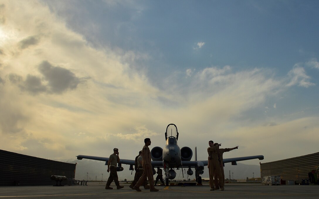 Aircrew personnel direct members of the 303rd Fighter Squadron, Whiteman Air Force Base, Mo., upon arrival to Bagram Airfield, Afghanistan, April 10, 2014. The arrival of the six aircraft marks a transition from the 75th Fighter Squadron, Moody Air Force Base, Ga., to the 303rd Fighter Squadron, Whitman Air Force Base, Mo. (U.S. Air Force photo/ Staff Sgt. Vernon Young Jr.)