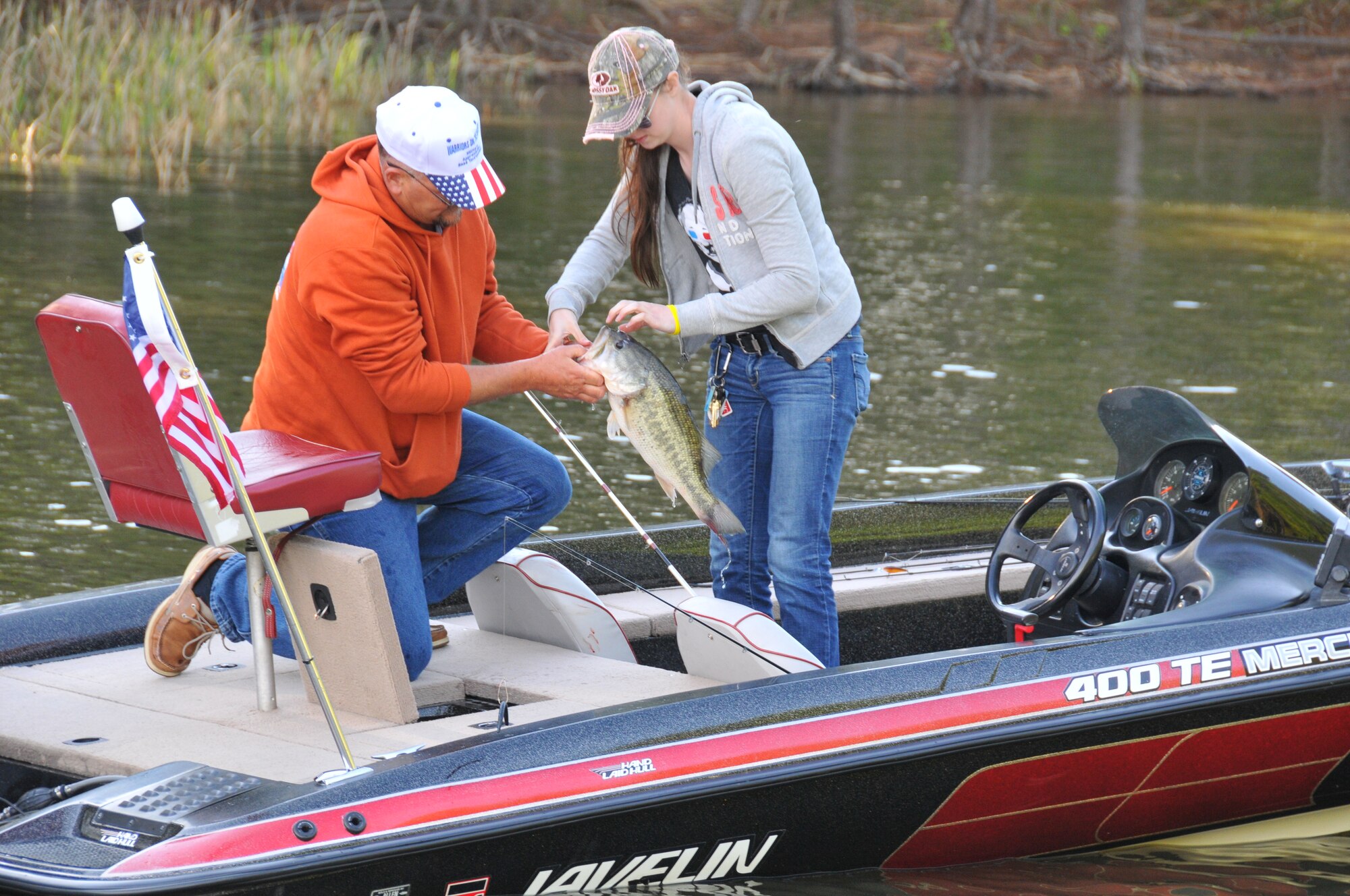 JORDAN LAKE STATE PARK, N.C. – Anglers hook a bass during the 9th Annual Warriors on the Water Military Appreciation Bass Fishing Tournament, here May 2.  WOW hosted 150 service men and women at the event to show appreciation for their service in the Armed Forces. (U.S. Air Force photo by Adam Luther)