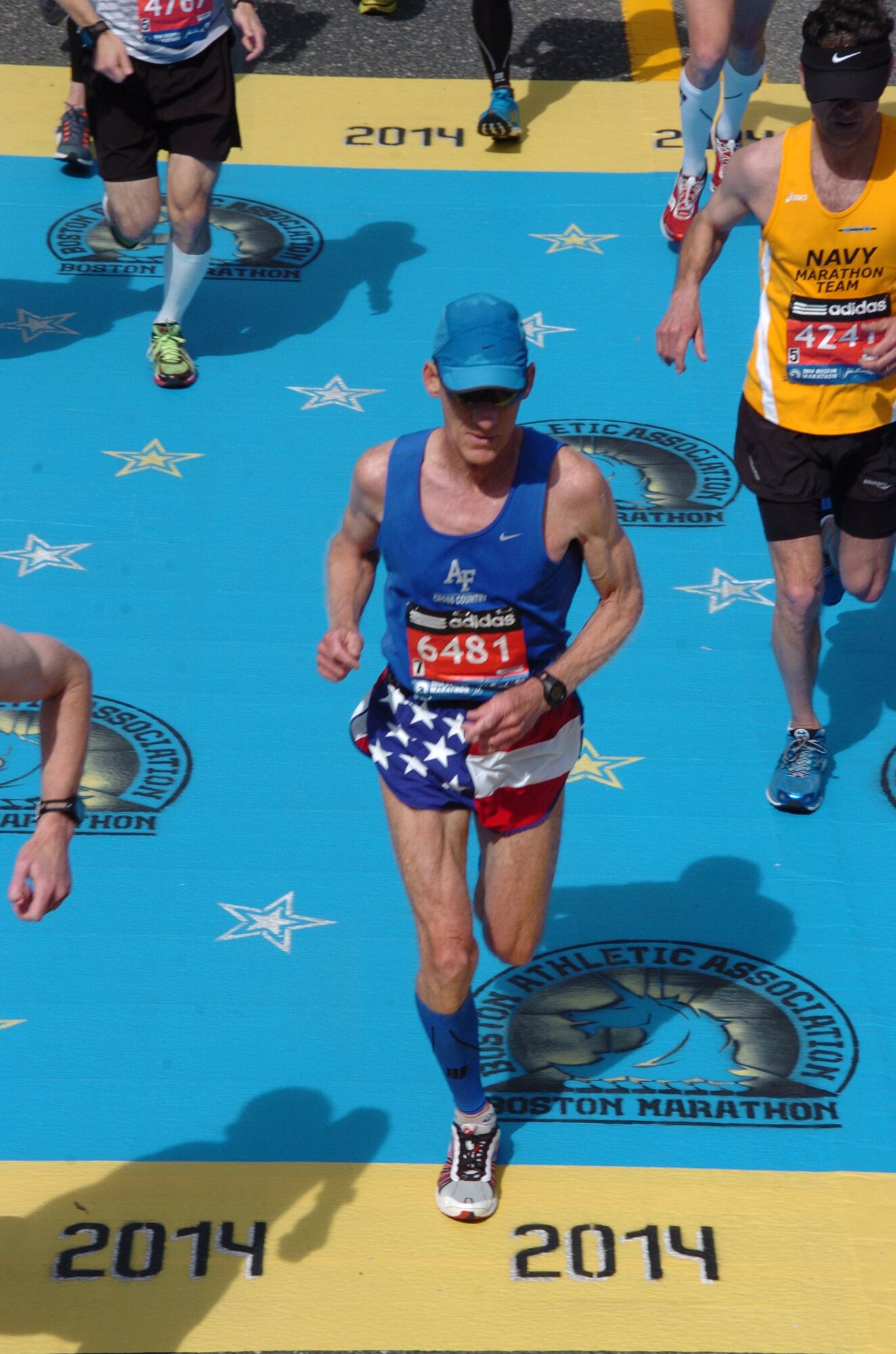 Pat Rupel, a retired lieutenant colonel and pilot with the 970th Airborne Air Control Squadron at Tinker Air Force Base, Oklahoma, crosses a checkpoint at the Boston Marathon on April 28. Rupel beat more than 2,000 runners to win the 60 to 64 year-old male division. (Courtesy photo)