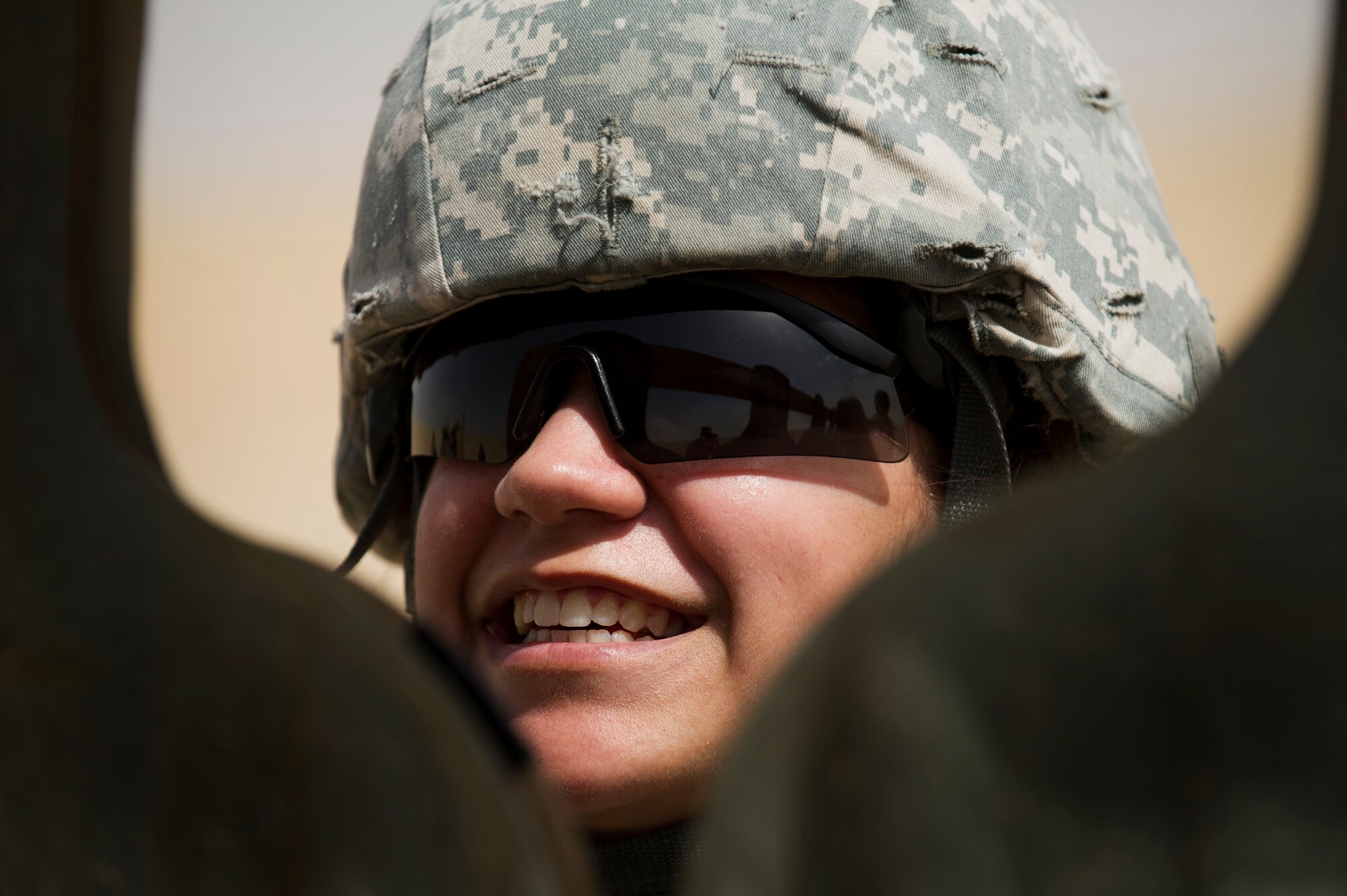 Senior Airman Christina White, a Force Protection Airman with the 387th Expeditionary Support Squadron, hangs a target prior to engaging it with her M-9 pistol.  White, a native of Bushkill, Pa., received weapons proficiency training with combat arms instructors from the 387th Expeditionary Security Forces Squadron while deployed to the AOR.  Because Force Protection Airmen act as augmentees to security forces, it is important that they receive on-going proficiency training to ensure they are ready to properly react and respond during times of increased threats.  (U.S. Air Force photo by Senior Master Sgt. Burke Baker)