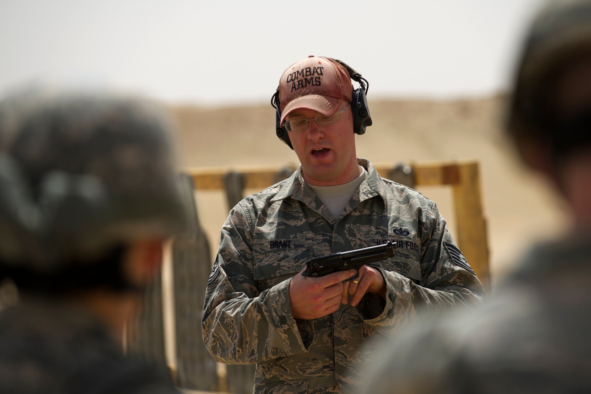 Tech. Sgt. Jason Brant, a combat arms instructor with the 387th Expeditionary Security Forces Squadron, conducts weapons proficiency training with Force Protection Airmen from the 387th Expeditionary Support Squadron.  Because Force Protection Airmen act as augmentees to security forces, it is important that they receive on-going proficiency training to ensure they are ready to properly react and respond during times of increased threats.  (U.S. Air Force photo by Senior Master Sgt. Burke Baker)