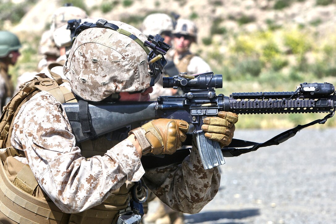 A Marine with Bravo Company, 7th Engineer Support Battalion, 1st Marine Logistics Group, fires his M16A4 rifle during Table III of the Combat Rifle Program aboard Camp Pendleton, Calif., April 23, 2014. Forty-six Marines, firing close to 8,500 rounds, completed day and night live-fire drills to sustain the skills they learned during Marine Combat Training. These abilities include engaging a target using pivot techniques, while moving, at an unknown distance and at night with Target Pointer Aiming Lights.