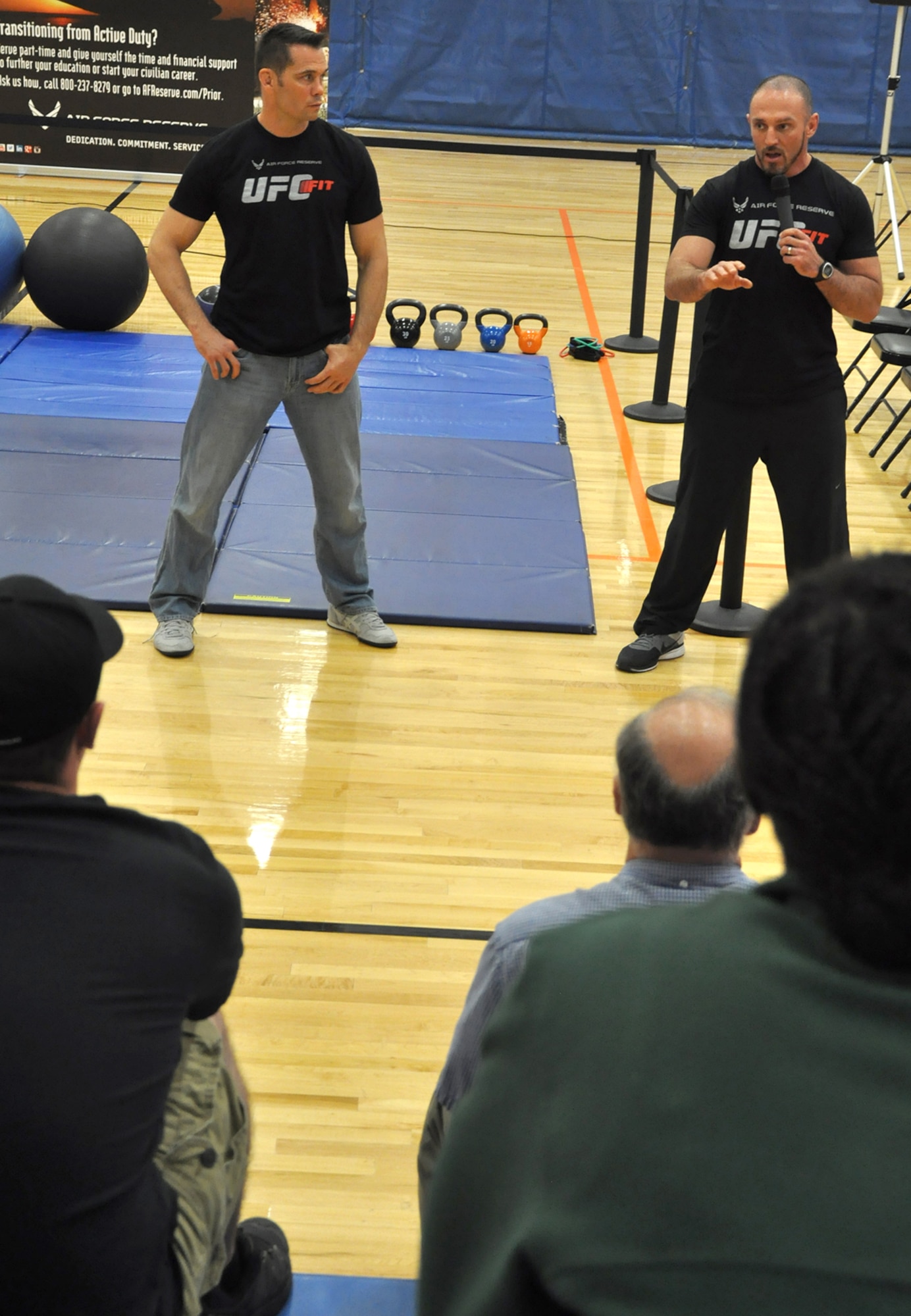 From left, UFC Middleweight Champion Rich Franklin and UFC Fit Coach Mike Dolce answer questions from Airmen and Soldiers during a fitness workshop at Wilson Fitness Center at Lewis North May 3. The event, sponsored by Air Force Reserve Recruiting, was incorporated into this year’s Ultimate Fighting Champion Fit Tour. (U.S. Air Force Reserve photo by Tech. Sgt. Minnette Mason)