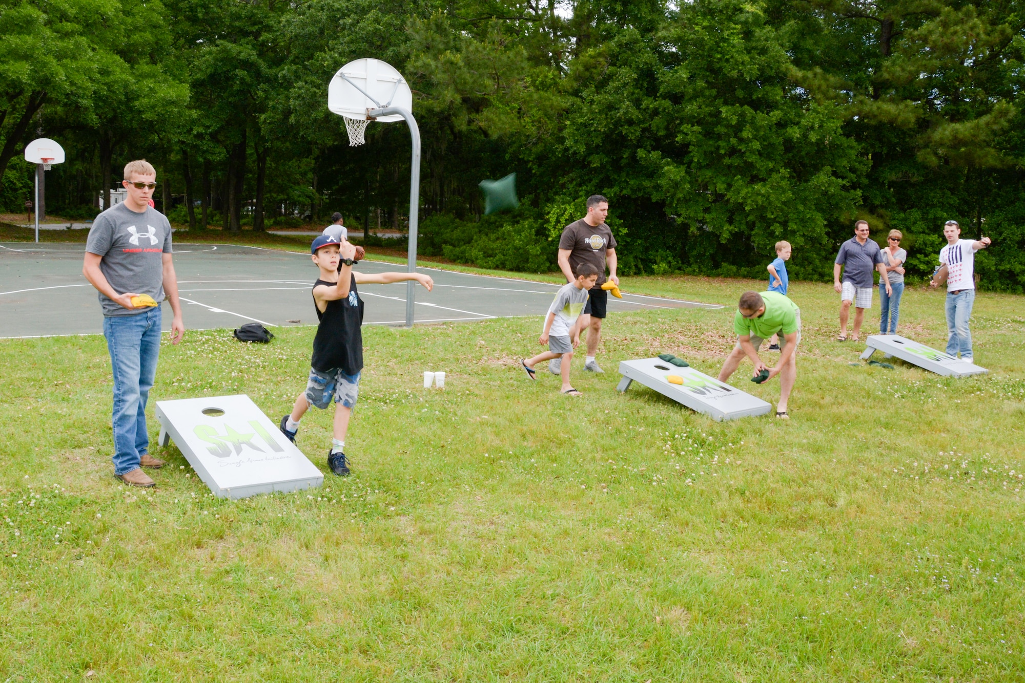Servicemembers and their families from across the installation enjoy a game of corn hole during the annual Joint Base Charleston Appreciation Picnic May 3, 2014 at the Air Base picnic grounds. The picnic offered free food, live entertainment and other activities to both adults and children. More than 2,000 people attended the picnic this year. (U.S. Air Force photo/Tech. Sgt. Shane Ellis)