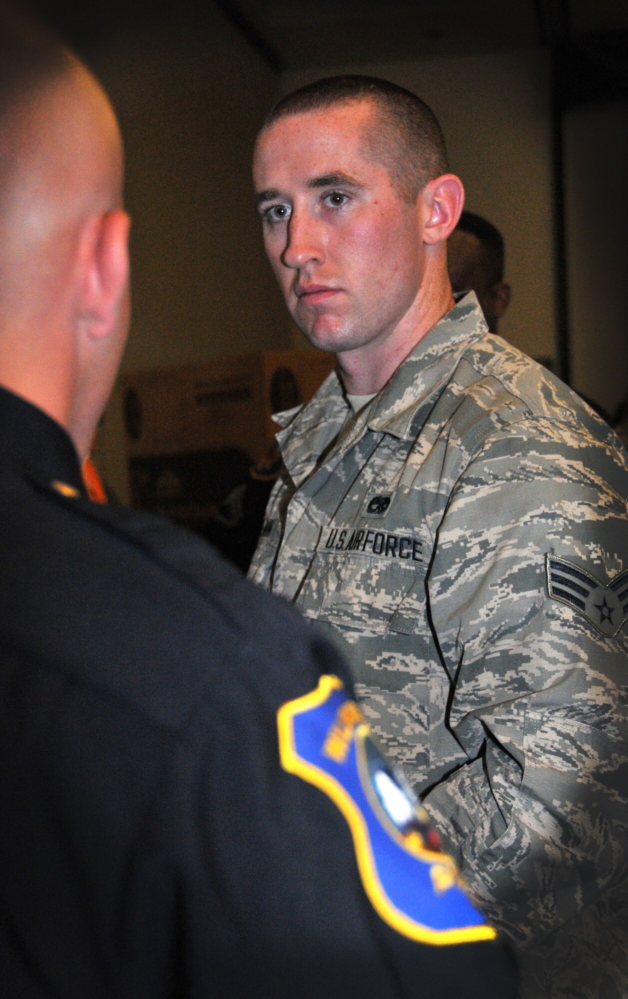 Senior Airman Stephen Slavin, 512th Aircraft Maintenance, talks with Cpl. Justin Cannon of the Wilmington Police Department during a job fair held May 4, 2014, at the Landings on Dover Air Force Base, Del. Cannon stated that the police department values recruits with military background. (U.S. Air Force photo/Tech. Sgt. Andria J. Allmond)