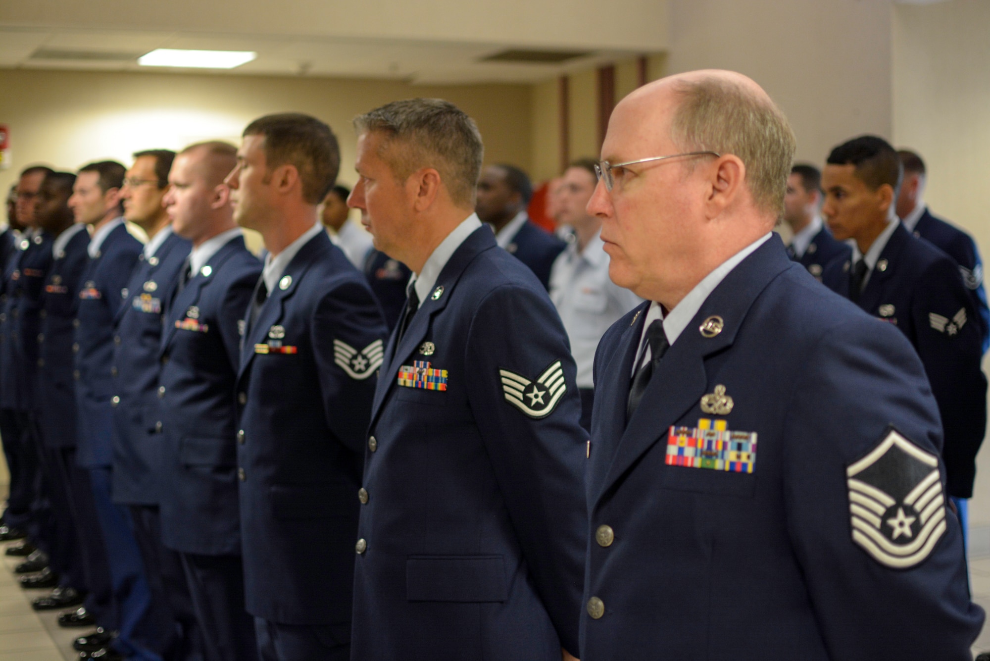 Airmen from the 315th Aircraft Maintenance Squadron at Joint Base Charleston, S.C. prepare for an open ranks inspection May 4, 2014. Open ranks inspections are conducted periodically in order to ensure Airmen maintain professional dress and appearance standards. These U.S. military inspections date back to the late 1700s, during the time of General George Washington, when drill regulations were introduced to citizen soldiers of revolutionary forces. (U.S. Air Force photo/Tech Sgt Shane Ellis)