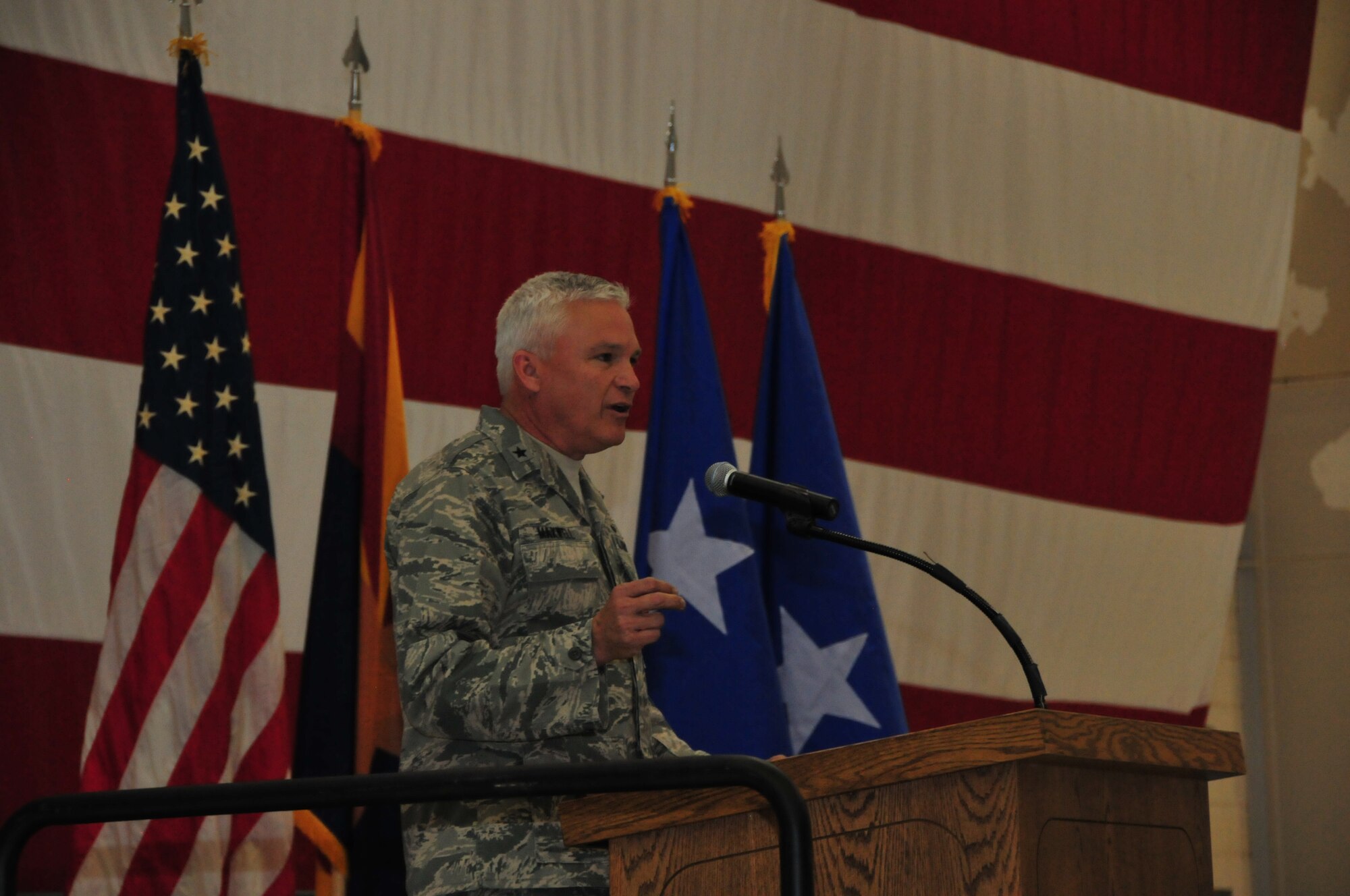 Brigadier General Edward Maxwell, Assistant Adjutant General – Air, Arizona National Guard, congratulates Airmen during a wing awards ceremony at the 161st Air Refueling Wing, Phoenix, May 3, 2014. The ceremony recognized the 161 ARW’s Outstanding Airmen of the Year, Air National Guard Flight Crew Flight Equipment competition winner, recipients of the federal Meritorious Service Medal, Associate Degree recipients from the Community College of the Air Force and a recipient of the Air Medal. In addition, the Albert Leo Burns Trophy, the Hugh P. Kelly Memorial Award and the Copper 5 Award were awarded. (U.S. Air National Guard Photo by Staff Sgt. Courtney Enos/Released)