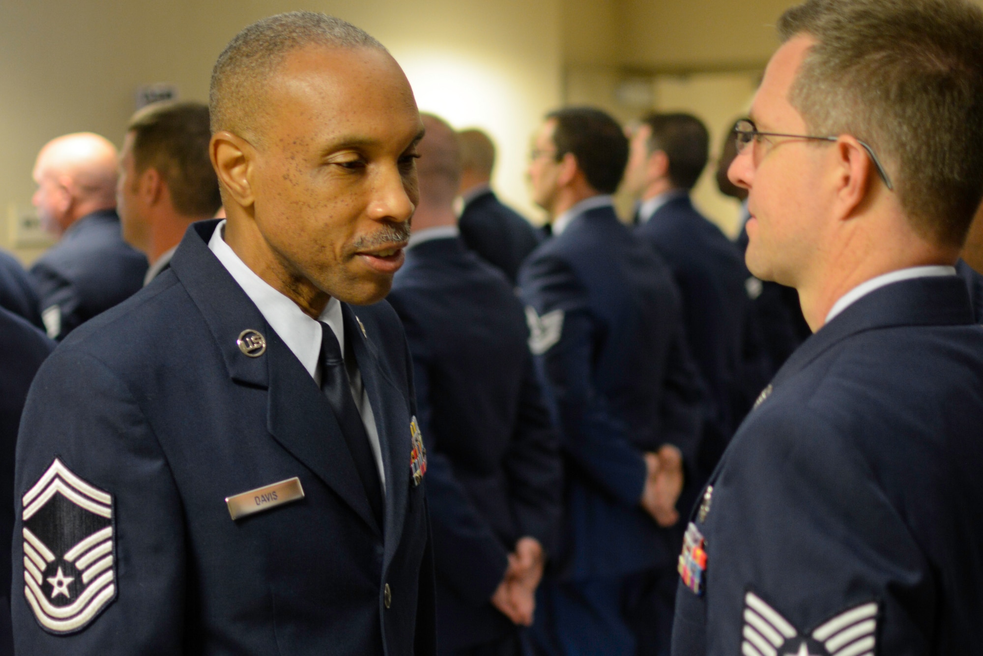 Senior Master Sgt. Tom Davis, 315th Aircraft Maintenance Squadron section chief, performs a uniform inspection during an open ranks inspection May 4, 2014 at Joint Base Charleston, S.C. Open ranks inspections are conducted periodically in order to ensure Airmen maintain professional dress and appearance standards. These U.S. military inspections date back to the late 1700s, during the time of General George Washington, when drill regulations were introduced to citizen soldiers of revolutionary forces. (U.S. Air Force photo/Tech Sgt Shane Ellis)