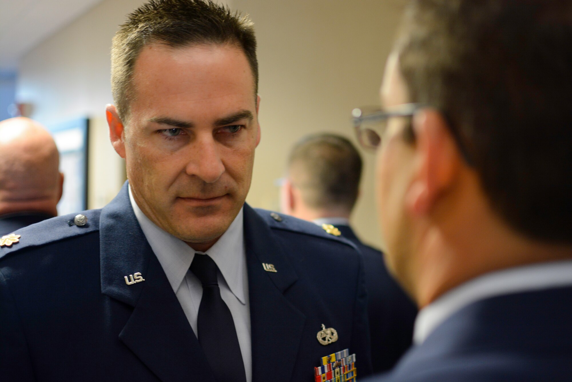 Maj. Taylor Adams, 315th Aircraft Maintenance Squadron flight commander, inspects a uniform during an open ranks inspection May 4, 2014 at Joint Base Charleston, S.C. Open ranks inspections are conducted periodically in order to ensure Airmen maintain professional dress and appearance standards. These U.S. military inspections date back to the late 1700s, during the time of General George Washington, when drill regulations were introduced to citizen soldiers of revolutionary forces. (U.S. Air Force photo/Tech Sgt Shane Ellis)