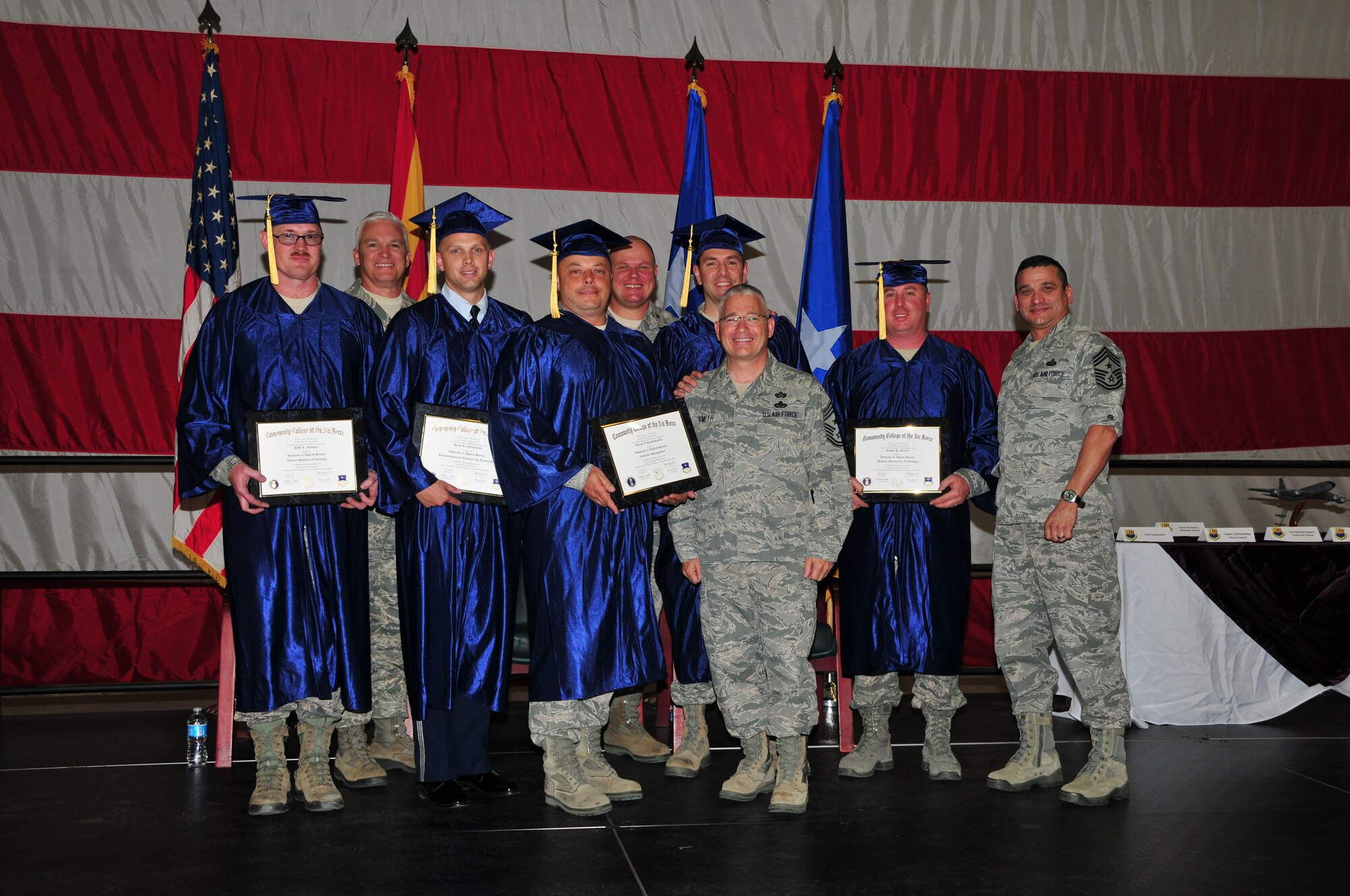 Airmen who have graduated from the Community College of the Air Force are recognized during a wing wide ceremony at the 161st Air Refueling Wing, Phoenix, May 3, 2014. The ceremony recognized the 161 ARW’s Outstanding Airmen of the Year, Air National Guard Flight Crew Flight Equipment competition winner, recipients of the federal Meritorious Service Medal, Associate Degree recipients from the Community College of the Air Force and a recipient of the Air Medal. In addition, the Albert Leo Burns Trophy, the Hugh P. Kelly Memorial Award and the Copper 5 Award were awarded. (U.S. Air National Guard Photo by Staff Sgt. Courtney Enos/Released)