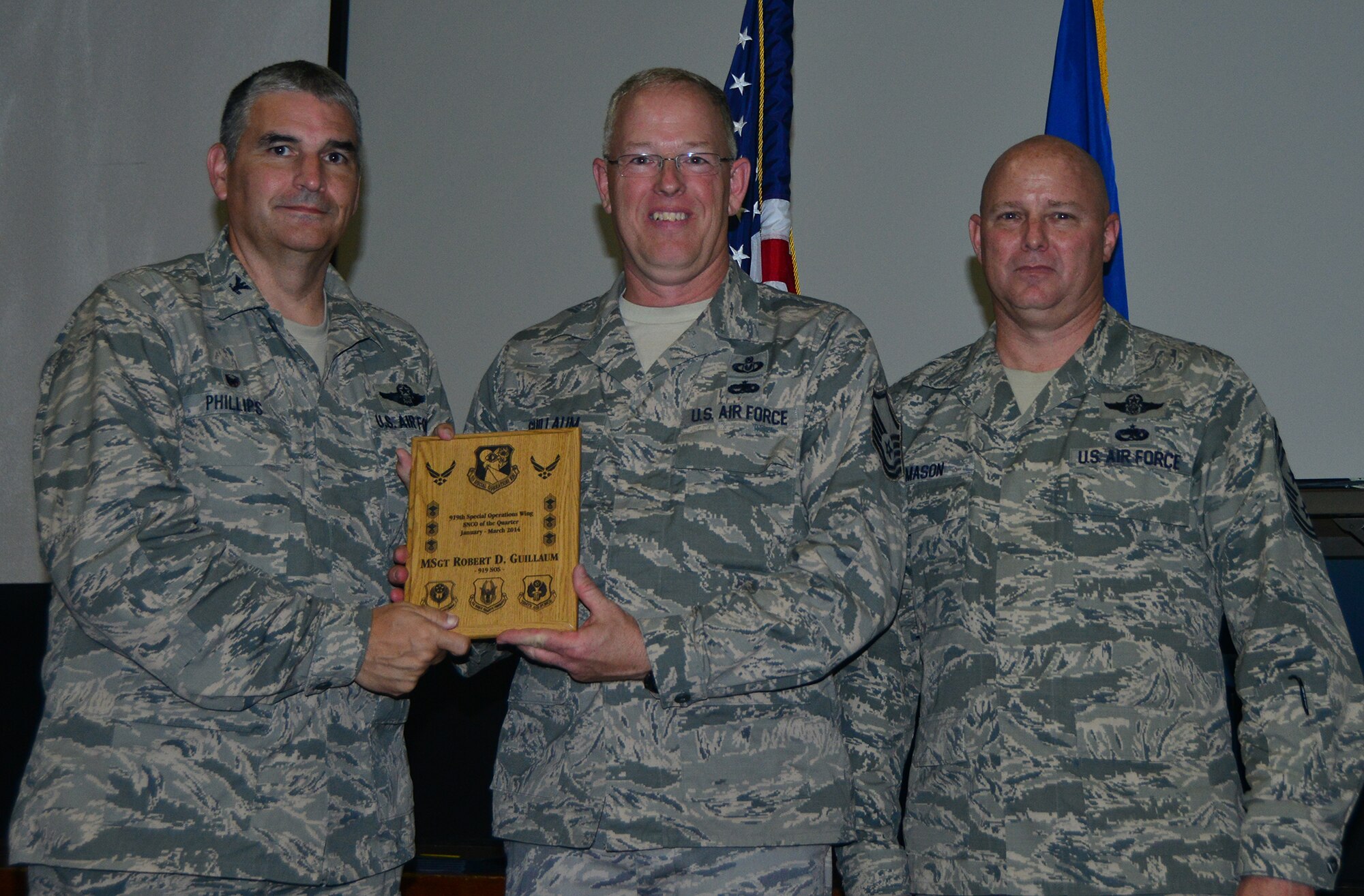 Master Sgt. Robert Guillaum, 919th Special Operations Support Squadron, receives his plaque as first quarter senior non-commissioned officer at Duke Field May 4.  The 919th Special Operations Wing awarded it first and second quarterly award winners at a small ceremony.  (U.S. Air Force photo/Tech. Sgt. Sam King)