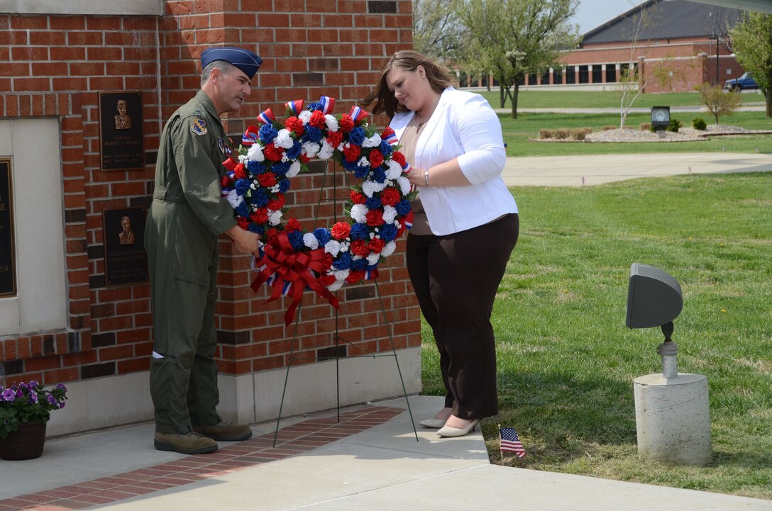 Col. Peter Nezamis, the 126th Air Refueling Wing Commander, and Bobbi Jo Cyr, Capt. Brandon Cyr’s sister, place a wreath as part of a memorial service for Cyr at Scott Air Force Base, Ill., April 24, 2014. Cyr died in a plane crash on April 27, 2013, while deployed to Afghanistan. The memorial service was presented by U.S. Air Force airmen of the 906 ARS and Illinois Air National Guard members assigned to the 126th Air Refueling Wing. (Air National Guard photo by Senior Airman Elise Stout)