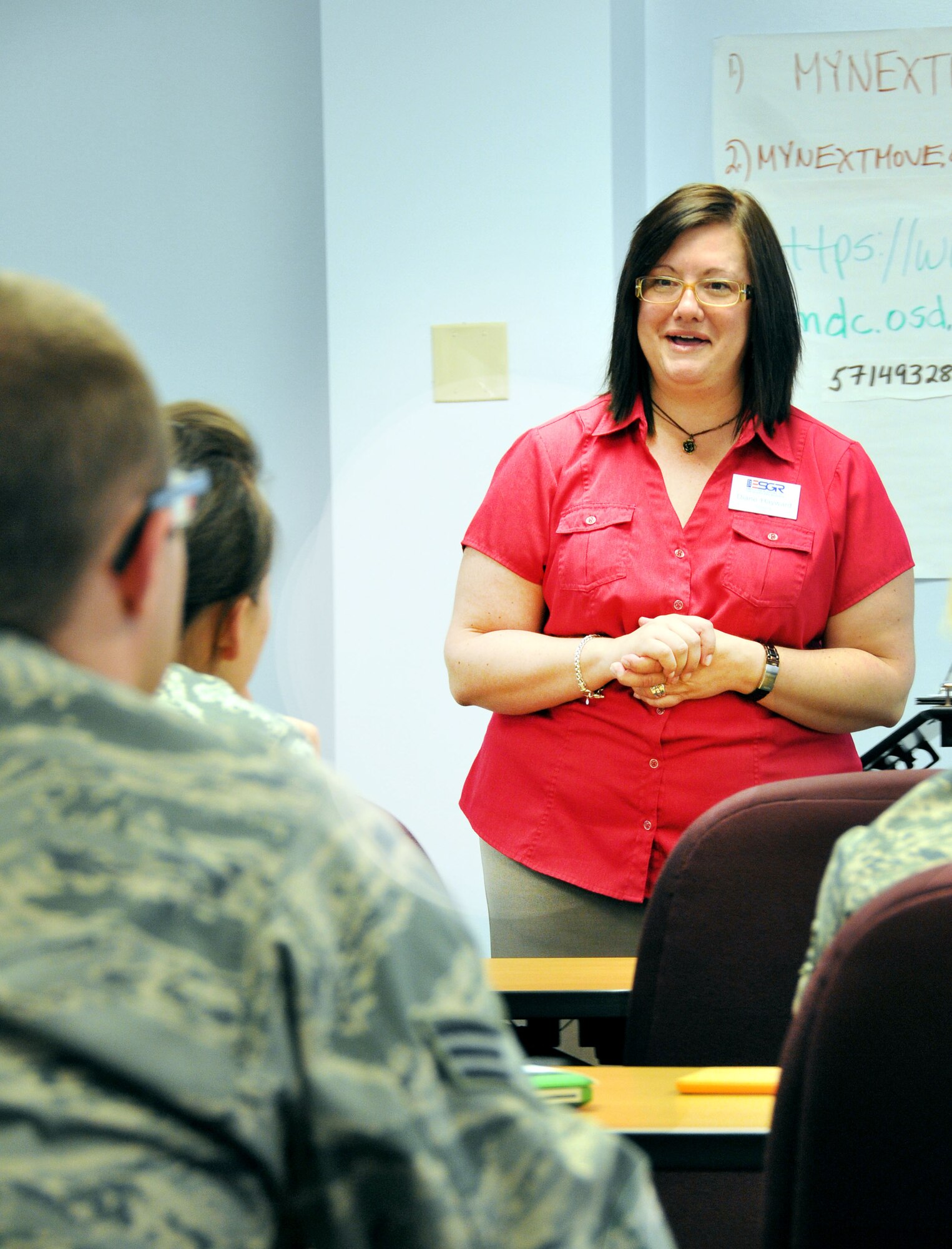 Diane Hayward, Employer Support of the Guard and Reserve volunteer, explains the resume process to a nearly 20-person crowd May 3, 2014 on Dover Air Force Base, Del. The audience consisted of reservists, military spouses and retirees taking part in a two-day event created to bolster employment opportunities for retirees, service members and their families. (U.S. Air Force photo/Tech. Sgt. Andria J. Allmond)