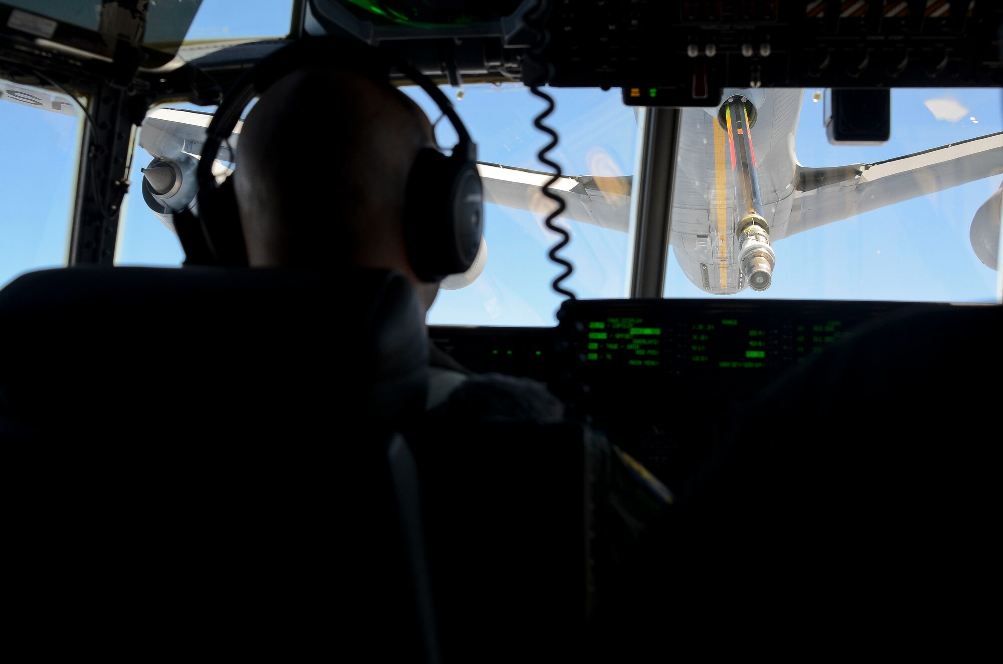 Maj. Nelson Bennet, a pilot assigned to the 79th Rescue Squadron, positions an HC-130J Combat King II behind a KC-135 Stratotanker for air-to-air refueling off the coast of Mexico May 03, 2014. Bennet and his crew transported U.S. Air Force pararescuemen from the 563rd Rescue Group to rescue two critically injured sailors 1,100 nautical miles off the coast of Mexico in the Pacific Ocean. The teams flew nearly 11 hours, requiring the in-air refueling, before the pararescue forces parachuted into the ocean along with two inflatable zodiac boats and medical equipment to deliver lifesaving care. The KC-135 was flown by Airmen from the Arizona Air National Guard’s 161st Air Refueling Wing. (U.S. Air Force photo by Staff Sgt. Adam Grant/Released)