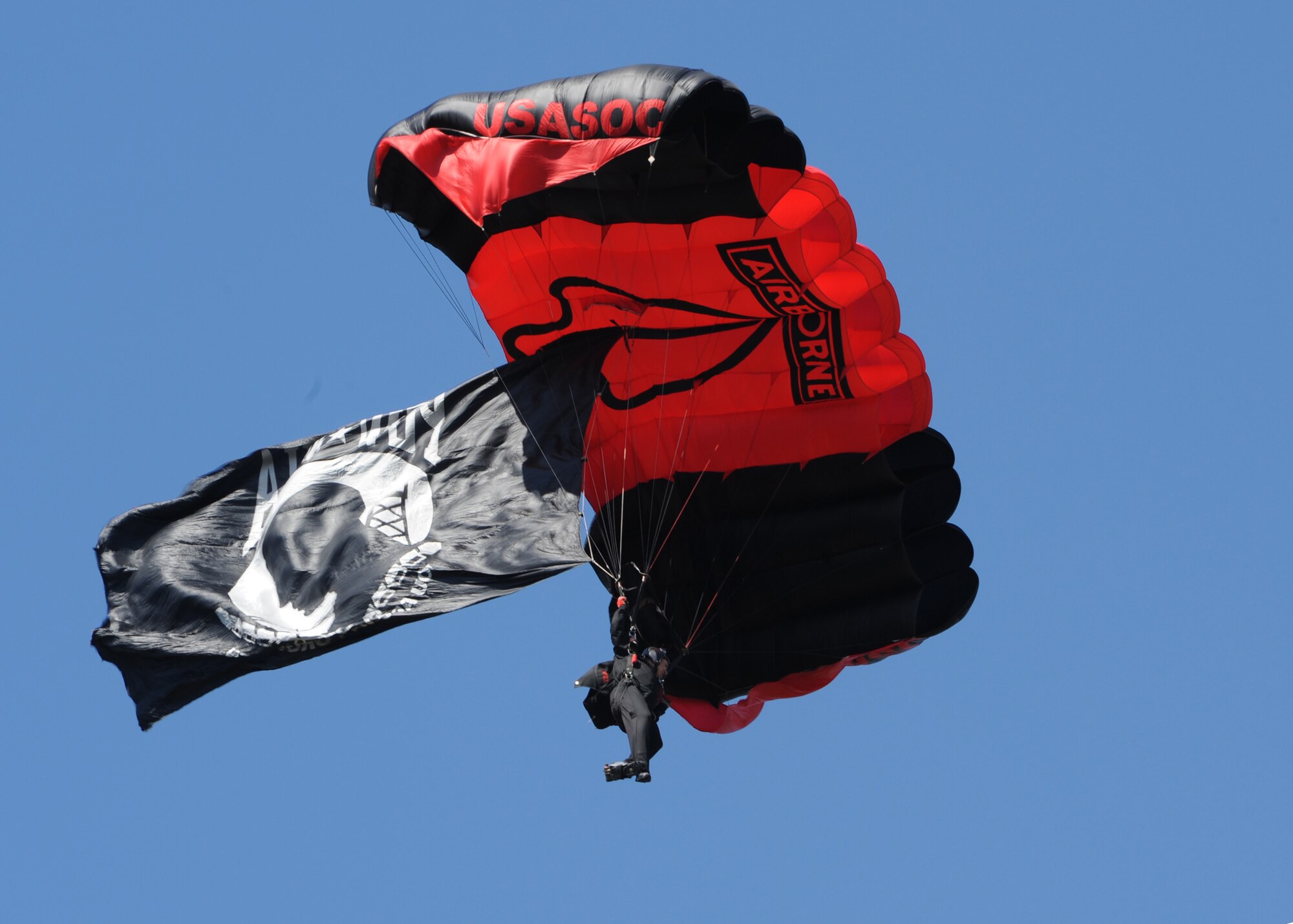 A U.S. Special Operations Command paratrooper descends upon Fort Bragg, N.C., during the inaugural running of the All-American Marathon on May 4, 2014.   According to race organizers, more than 1100 volunteers from Fort Bragg, Fayetteville and the surrounding communities made the races possible.  (U.S. Air Force photo by Tech. Sgt. Peter R. Miller)