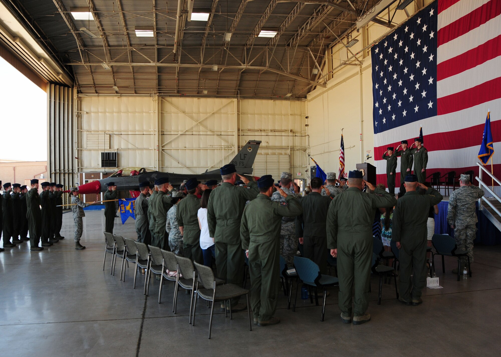 Lt. Col. Korey Amundson assumes command from Lt. Col. Gerald Brown May 2 during the 69th Fighter Squadron Change of Command ceremony. Col. Gregory Jones, 944th Operations Group commander, presided over the ceremony. (U.S. Air Force photo/Tech Sgt. Louis Vega Jr.)