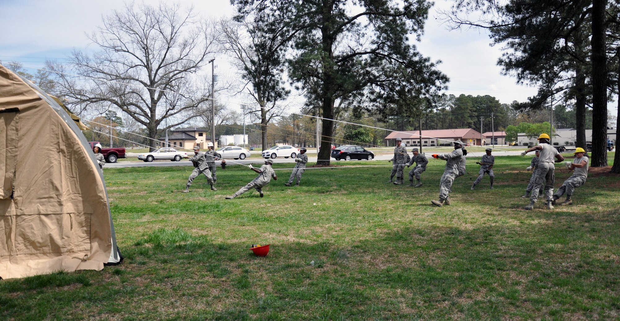 Members of the 916th Force Support Squadron and 567th Red Horse Squadron work together during shelter setup training in Debden Park, April 2014. FSS Airmen benefited from the expertise of Red Horse members while training on shelter setup, a responsibility shared by both units. (U.S. Air Force photo by Staff Sgt. Alan Abernethy, 916th ARW/PA)
