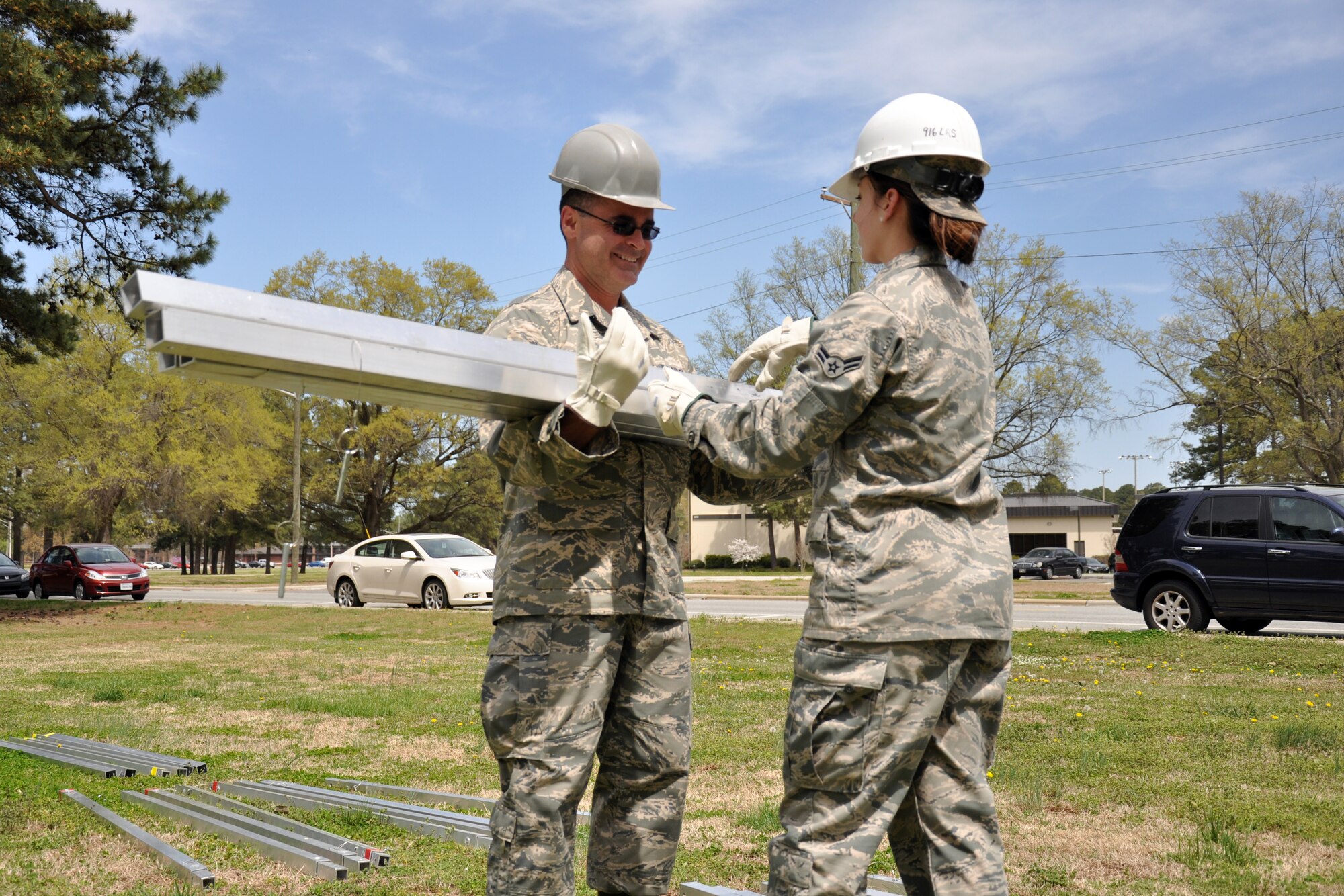 Tech. Sgt. Tim Kelly, 916th Force Support Squadron, and Airman 1st Class Rachel Patterson, 567th Red Horse Squadron, work together during shelter setup training in Debden Park, April 2014. 916th sustainment and personnel flights and 567th Red Horse members collaborated for training during the April drill weekend. (U.S. Air Force photo by Staff Sgt. Alan Abernethy, 916th ARW/PA)
