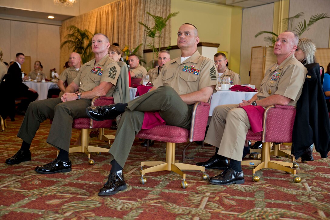 Sgt. Majs. Paul G. McKenna, left, Michael R. Saucedo, center, and Command Master Chief D. Eric Sine, listen to statements read during the Sexual Assault Prevention and Response luncheon April 25 at the Butler Officers’ Club on Camp Foster. The statements were written by sexual assault survivors who told how they received help, the services that were offered, how it could have been better, and to give thanks to those who helped them. McKenna is the sergeant major of 3rd Marine Division, III Marine Expeditionary Force. Saucedo is the sergeant major of Headquarters Battalion, 3rd Marine Division, III MEF. Sine is the Command Master Chief of 3rd Marine Division, III MEF. 
