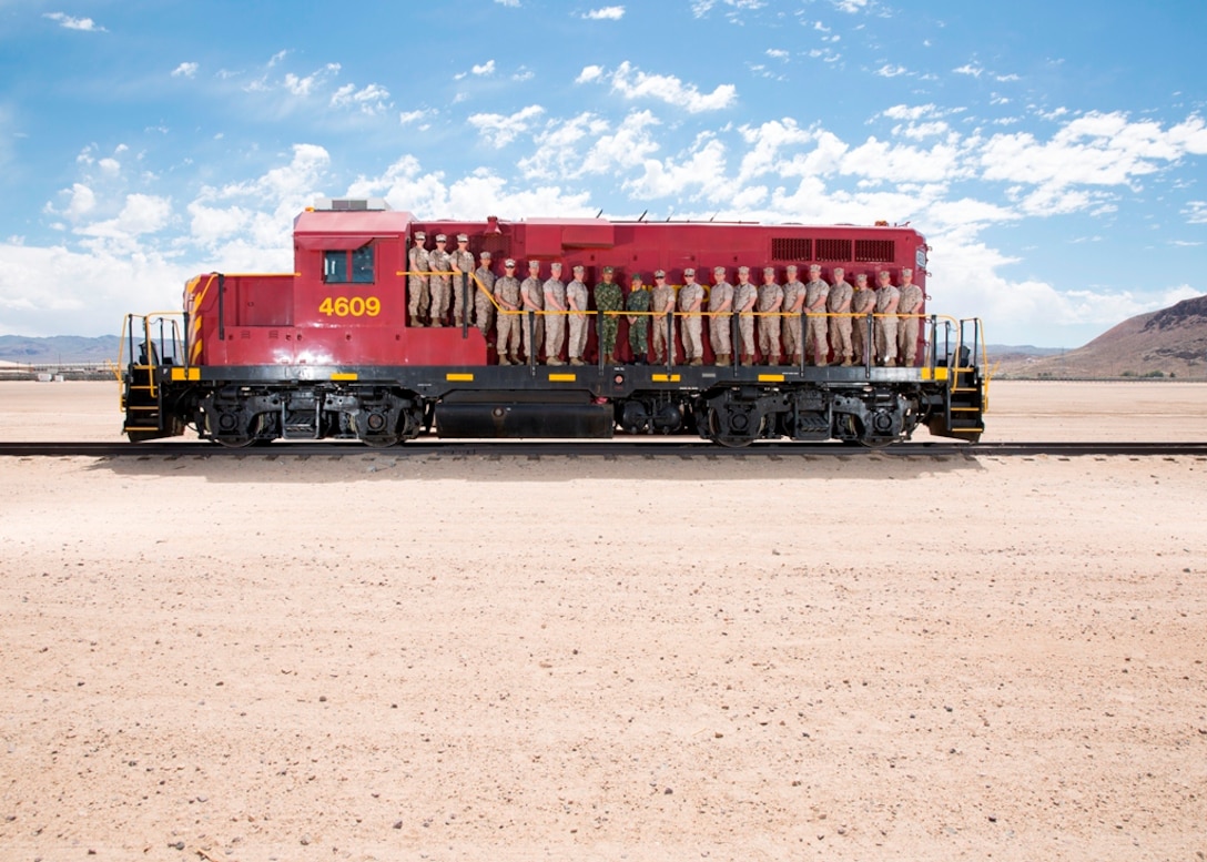 Students and instructors with the Expeditionary Warfare School, Quantico, Va., pose for a picture on a locomotive on Marine Corps Logistics Base Barstow’s rail yard, April 11. Supply and logistics students from the EWS came to tour MCLB Barstow as a part of the military occupation specialty specific training prior to their spring field exercise at Marine Air Ground Combat Center Twentynine Palms.