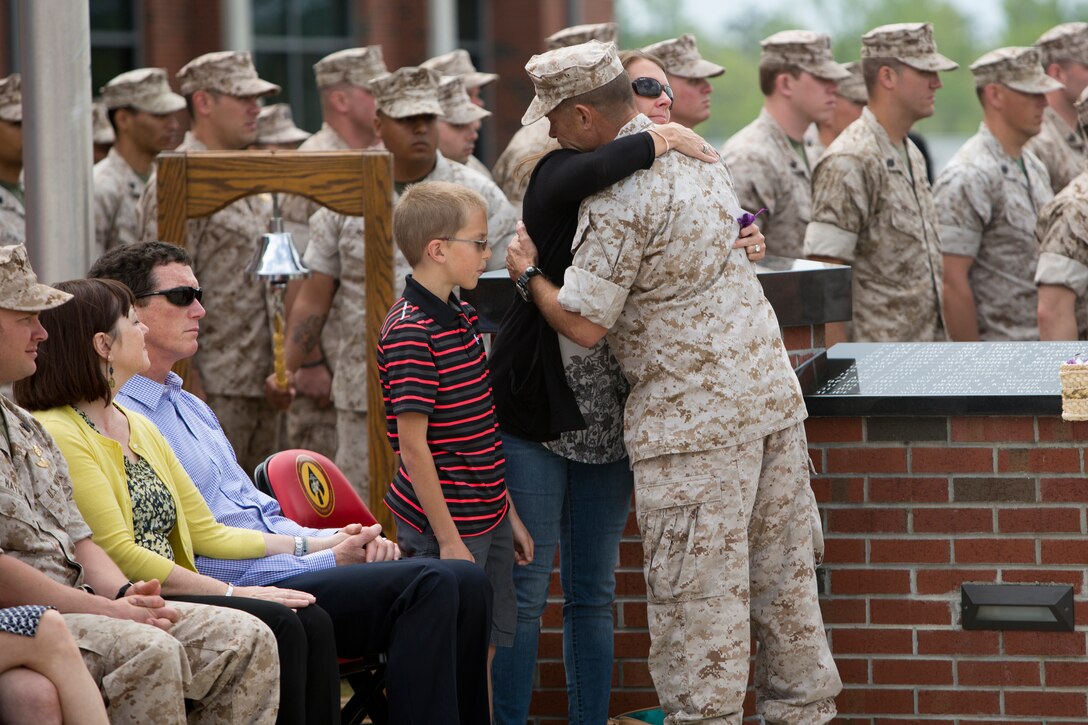 Major Gen. Mark A. Clark, commanding general of U.S. Marine Corps Forces Special Operations Command, embraces the family of  one of MARSOC’s fallen Marines, during ‘Honor the Fallen,’ a one-of-a-kind event, April 25, at the MARSOC headquarters, to honor all Marines, sailors and civilian Marines lost at home and abroad since MARSOC’s inception. “As our journey together continues, today is about our promise to 45 special people in our lives, that they made a difference, they mattered, that they will be remembered and will always hold a coveted place in our hearts,” said Clark.