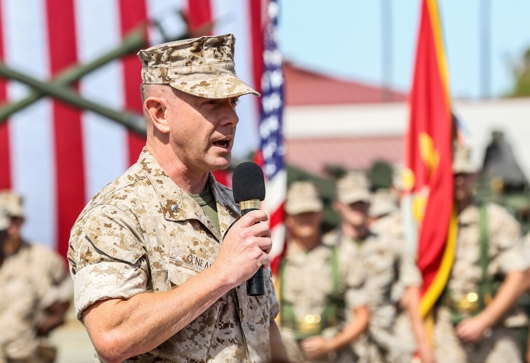 Lieutenant Col. John R. O'Neal, commanding officer, 15th Marine Expeditionary Unit, speaks about the impact of Lt. Col. William D. Wischmeyer, executive officer, 15th MEU, on the Marine Corps in his nearly 23 year career during his retirement ceremony aboard Camp Pendleton, Calif., May 1, 2014. Wischmeyer, 48, is from Clay, S.D. (U.S. Marine Corps photo by Cpl. Emmanuel Ramos/Released)