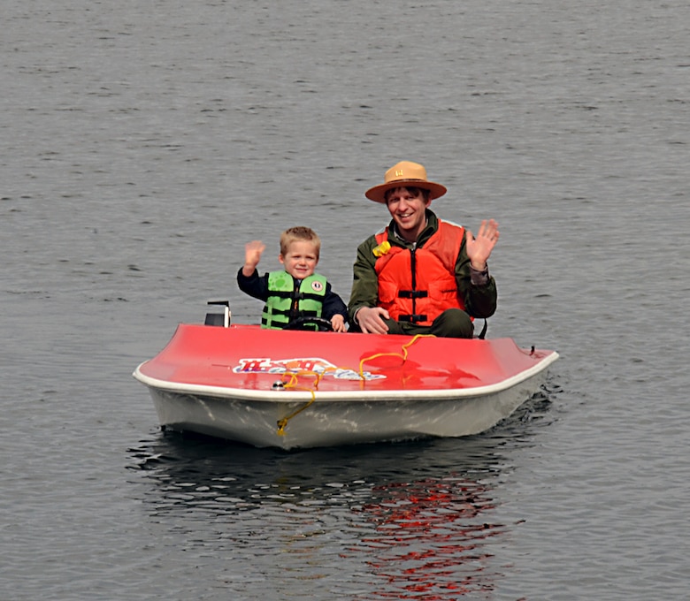 St. Paul District's Brad Labadie was out at Lake Minnetonka on April 26, 2014, to teach a little about water safety during the Victoria Lions Club's crappie fishing contest. Here, he's teaching a future water safety expert how to be a safe boater and to always wear your life jacket. The event was a fundraiser with all proceeds helping send 15 children to the American Diabetes Association's Camp Needlepoint in Hudson, Wis., for a week this summer. 