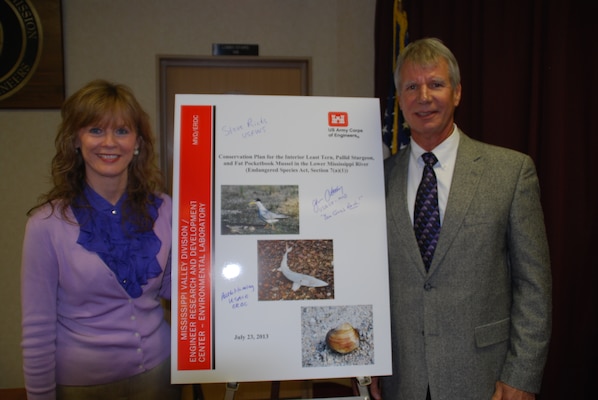 EL Director Dr. Beth Fleming, left, joined Conservation Management Plan author Dr. Jack Killgore, EL research fisheries biologist, for the signing ceremony marking the first step in a new way of complying with the Endangered Species Act.  