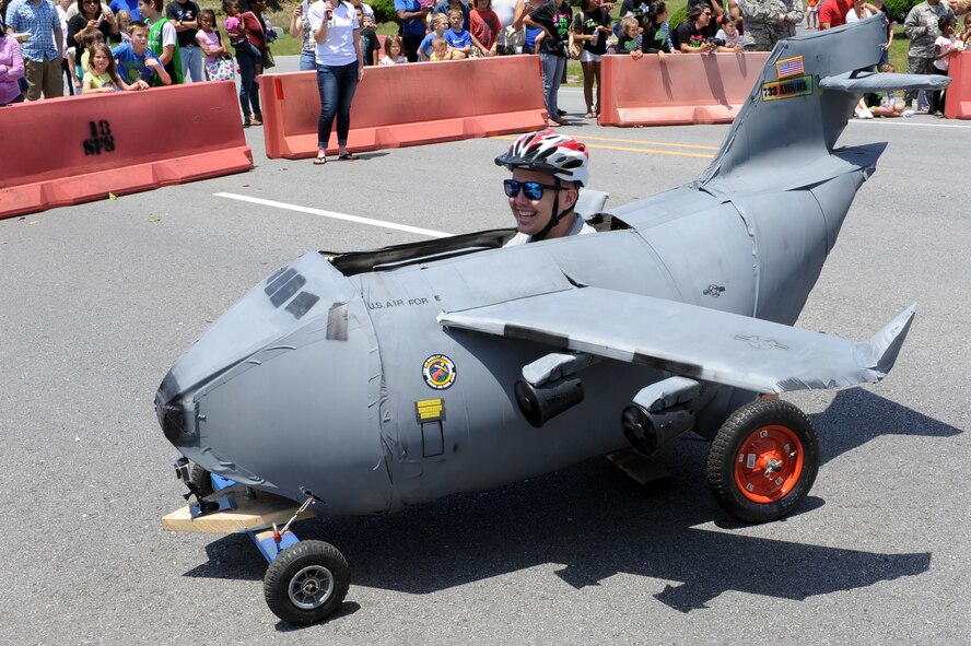 U.S. Air Force Tech. Sgt. Stephen Waters, 733rd Air Mobility Squadron crew chief, sits in “The Pacesetter,” the 733rd AMS’ entry into the Red Cross Derby Day competition on Kadena Air Base, Japan, April 26, 2014.  The Derby Day competition is an annual boxcar race fundraiser open to Status of Forces Agreement population, which generated more than $5,000 this year for Red Cross disaster relief services. (U.S. Air Force photo by Airman 1st Class Zade C. Vadnais)