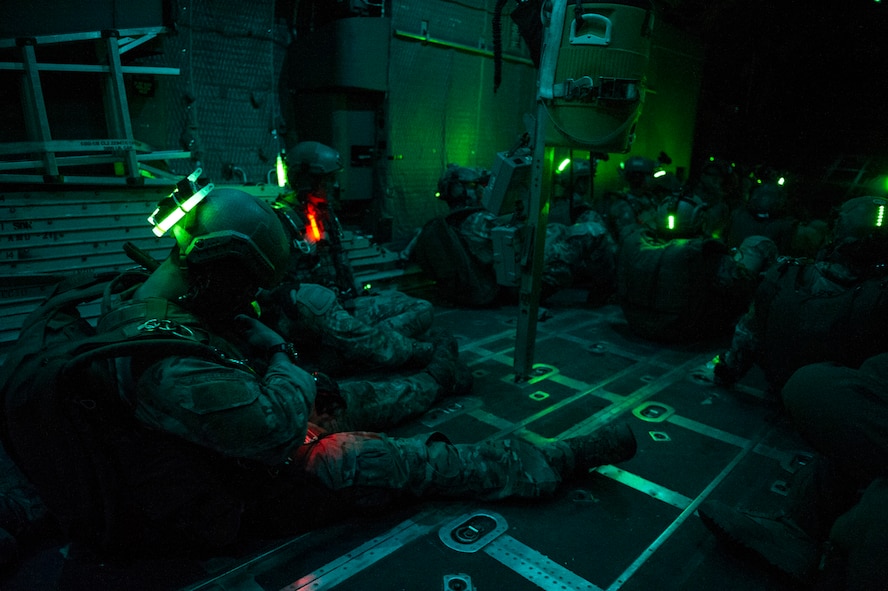 Members with the 22nd Special Tactics Squadron prepare for a night high-altitude low-opening jump from an MC-130H Combat Talon II during Emerald Warrior over Hurlburt Field, Fla., May 2, 2014. Emerald Warrior is an annual, joint exercise to train special operations, conventional and partner nation forces in combat scenarios designed to hone special operations air and ground combat skills, and is the Department of Defense's only irregular warfare exercise. (U.S. Air Force photo by Staff Sgt. Marleah Miller)