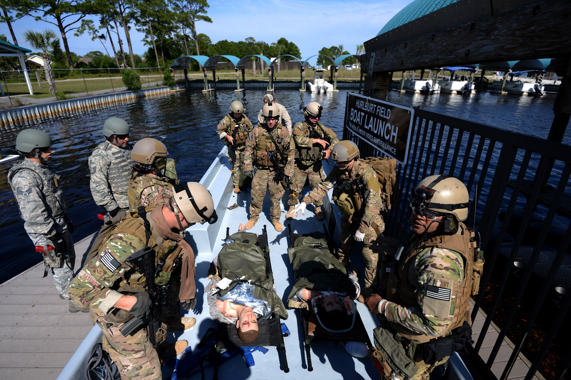 U.S. Air Force Airmen from the 919th Special Operations Security Forces Squadron, Duke Field, and the 1st Special Operations Support Squadron, Hurlburt Field Air Force Base, participate in a mock deployment situation which injured Airmen are found, given medical care, and extracted as a part of Emerald Warrior, Hurtlburt Field Air Force Base, Fla., May 02, 2014. Emerald Warrior is an annual, joint exercise to train special operations, conventional and partner nation forces in combat scenarios designed to hone special operations air and ground combat skills, and is the Department of Defense's only irregular warfare exercise. (U.S. Air Force photo by Senior Airman Justyn M. Freeman)