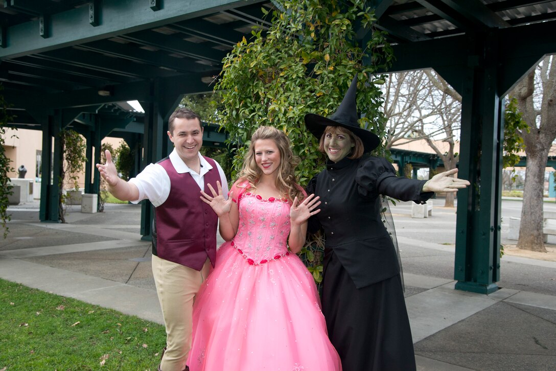 Airman First Class George Brahler, Senior Airman Meg Hokaj, and Chief Master Sergeant Kathy Munn pose in "Wicked" costumes before their February, 2013 performances with the Concert Band
