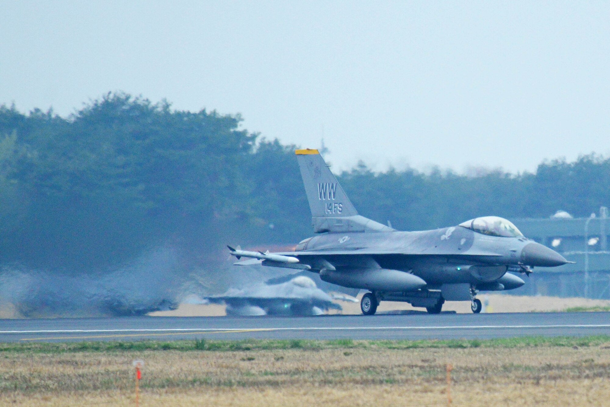 U.S. Air Force F-16 Fighting Falcons take off during Phase II of an operational readiness exercise at Misawa Air Base, Japan, May  5, 2014. The 35th Fighter Wing Wild Weasel’s stand fully prepared to defend the Pacific region and deter or defeat any aggressor with allies and partners. (U.S. Air Force photo/Senior Airman Derek VanHorn)