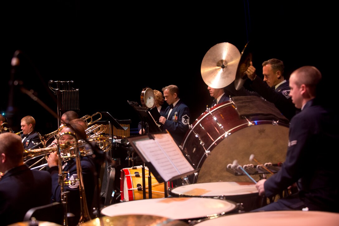 Senior Master Sergeant Rick Thorp, cymbals, and Master Sergeant Jon Linker, tambourine, inspire a Vacaville, California crowd with their visual percussion playing. February, 2013.