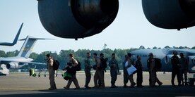 Joint Base Charleston leadership welcomes home Airmen during the 17th Airlift Squadron redeployment May 3, 2014, at Joint Base Charleston, S.C. During their two-month deployment to Southwest Asia, the squadron completed more than 800 sorties, logged in 2,381 flying hours and airlifted more than 28.5 million pounds of cargo and approximately 18,700 passengers. (U.S. Air Force photo/Staff Sgt. AJ Hyatt)