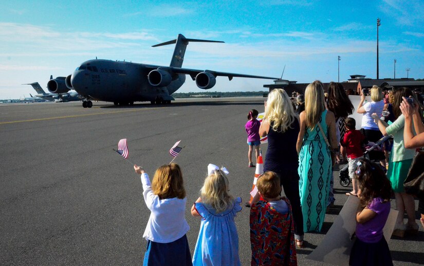 Family members and co-workers await the return of the 17th Airlift Squadron May 3, 2014, at Joint Base Charleston, S.C. The 17th AS is returning from a two-month deployment to Southwest Asia. (U.S. Air Force photo/Staff Sgt. AJ Hyatt)