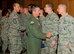 Col. David E. Graff, 325th Fighter Wing commander, and Chief Master Sgt. Christopher Lantagne, 325th FW command chief, congratulate the new promotees May 2 at Horizons Community Center. (U.S. Air Force photo by Airman 1st Class Alex Echols)