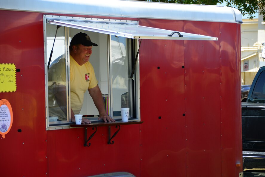 A snow cone vendor waits for customers during Duke Field’s Family Day event May 3.  The 919th Special Operations Wing sets aside a special day each year to show appreciation for its reservists and their family members. Events included music, sports, children’s games, etc. (U.S. Air Force photo/Tech. Sgt. Jasmin Taylor)