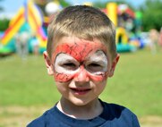 Tullio Zampieri, son of Staff Sgt. Matthew Zampieri of 919th Special Operations Communications Squadron, shows off his face paint during Duke Field’s Family Day event May 3.  The 919th Special Operations Wing sets aside a special day each year to show appreciation for its reservists and their family members. Events included music, sports, children’s games, etc. (U.S. Air Force photo/Tech. Sgt. Cheryl L. Foster)