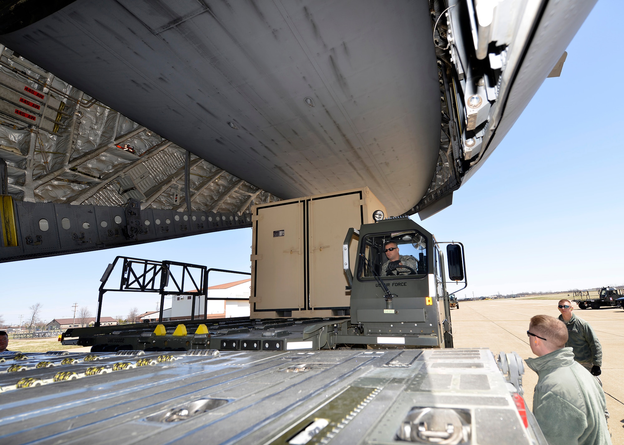 30th Aerial Port Squadron members from the 914th Airlift Wing load equipment on to a C-17 transient aircraft at the Niagara Falls Air Reserve Station, N.Y. April 24, 2014.  This aircraft and equipment was used in support of a Warrior Exercise at Ft. McCoy, Wis.  (U.S. Air Force photo by Tech. Sgt. Joseph McKee)