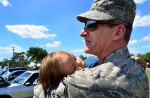 Master Sgt. Floyd Belanger, 919th Special Operations Medical Squadron, carries his sleeping son during Duke Field’s Family Day event May 3.  The 919th Special Operations Wing sets aside a special day each year to show appreciation for its reservists and their family members. Events included music, sports, children’s games, etc. (U.S. Air Force photo/Tech. Sgt. Cheryl L. Foster)