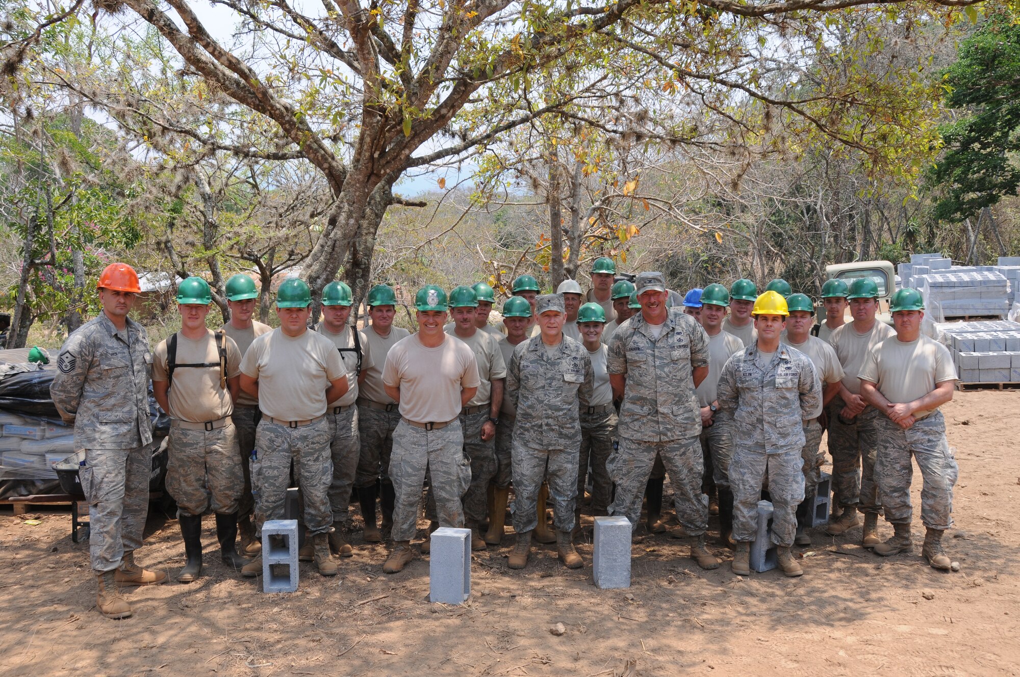 Brig. Gen. Mark Berry, Arkansas Air National Guard chief of staff, and Col. Pete Gauger, 188th Fighter Wing vice commander, pose for a photo with 188th Civil Engineer Squadron members during a site visit in Guatemala April 15. The 188th Civil Engineering Squadron deployed to Guatemala in support of a U.S. Army South-led humanitarian mission called Beyond the Horizon.  The 188th Airmen were there to build a school in the remote town of El Robles, Guatemala. (U.S. Army photo by Lt. Col. Richard Garringer/released)

