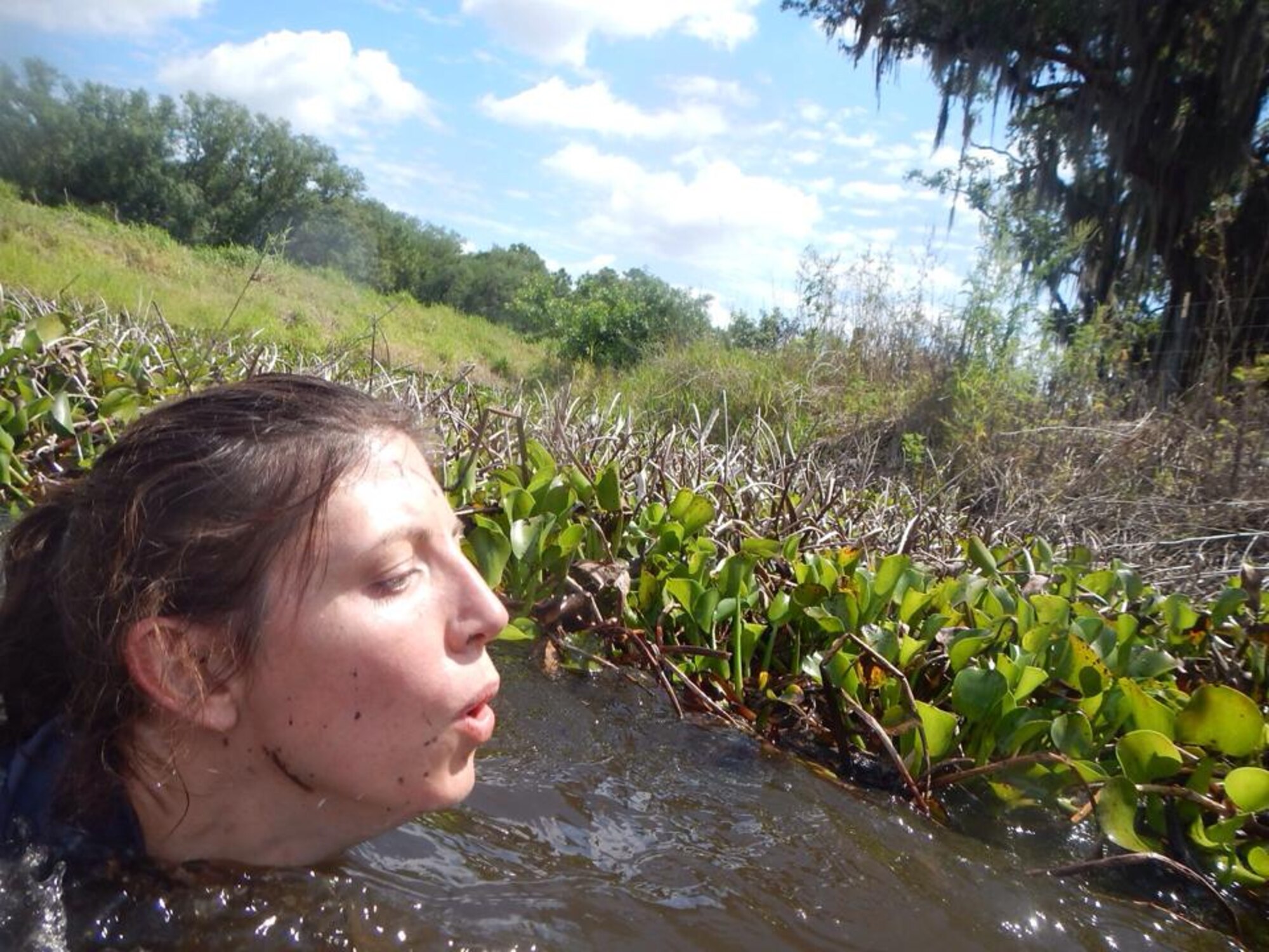 Master Sgt. Sherri Moore navigates a canal during the Tough Mudder competition. “The canals were nice and refreshing, despite the smell and fear of meeting a snake or alligator," she said. (Courtesy Photo)