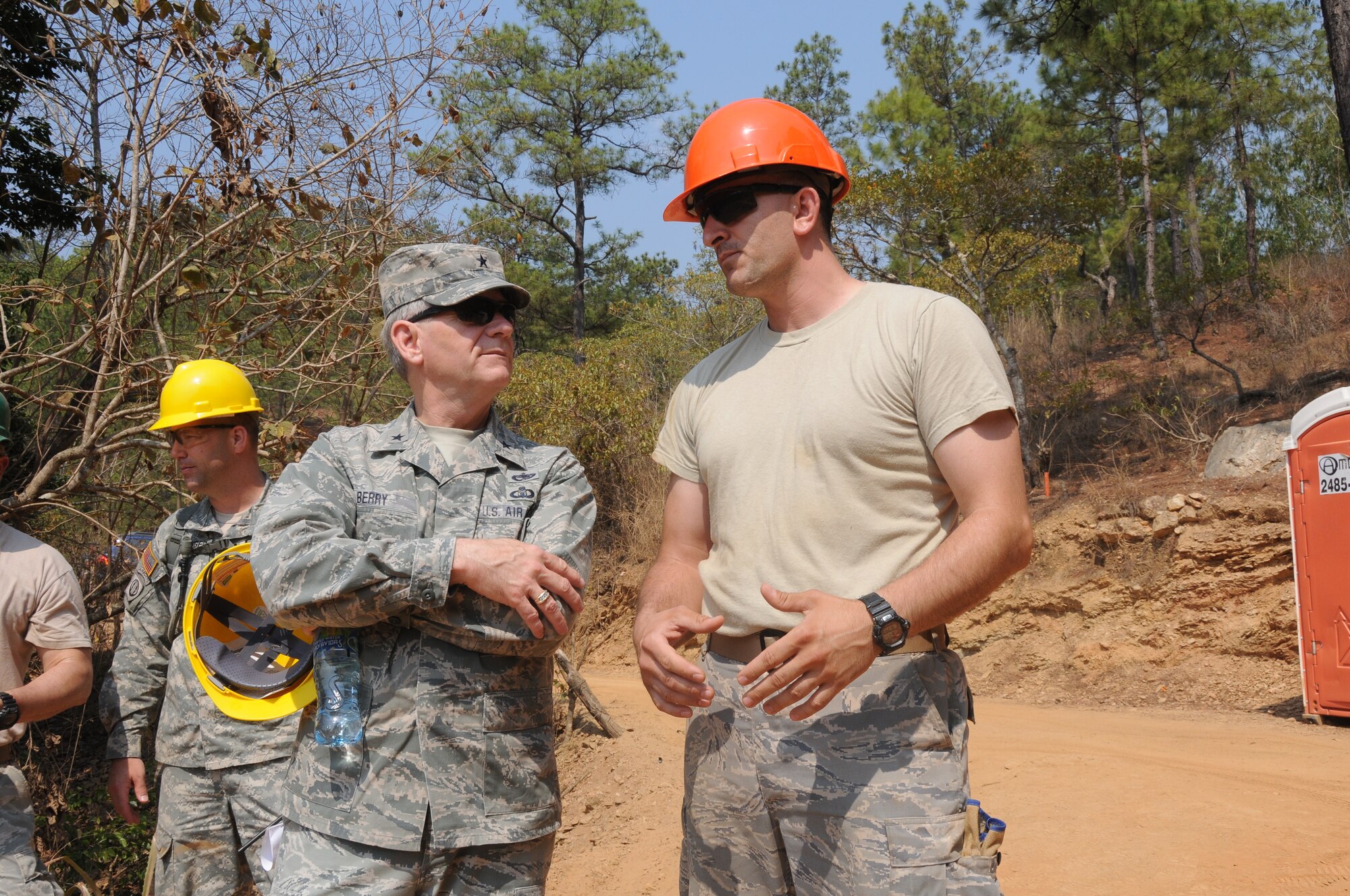 Brig. Gen. Mark Berry, Arkansas Air National Guard chief of staff, right, and Master Sgt. Josh Rich, 188th Civil Engineer Squadron first sergeant, converse during a site visit in Guatemala April 15, 2014. The 188th Civil Engineer Squadron deployed to Guatemala in support of a U.S. Army South-led humanitarian mission called Beyond the Horizon. The 188th Airmen were there to build a school in the remote town of El Robles, Guatemala. (U.S. Air National Guard photo by Maj. Heath Allen/released)