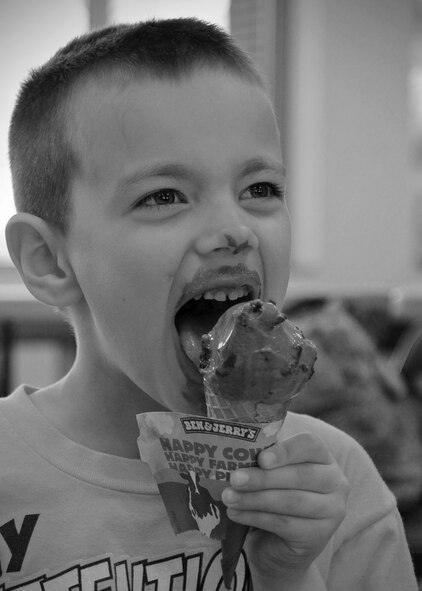 Triston, 5, eats ice cream during the Key Spouse ice cream social at Fairchild Air Force Base, Wash., May 1, 2014. Key spouses, key spouse mentors and their families were invited to bond with other families. (U.S. Air Force photo by Airman 1st Class Janelle Patiño/Released)