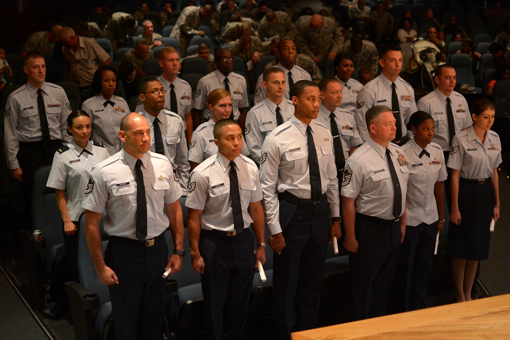 Hundreds of family members and friends gathered at the Air Base Theater May 5, 2014 at Joint Base Charleston, South Carolina to celebrate the academic accomplishments of 64 Community College of the Air Force graduates. (U.S. Photo by Tech. Sgt. Shane Ellis)

