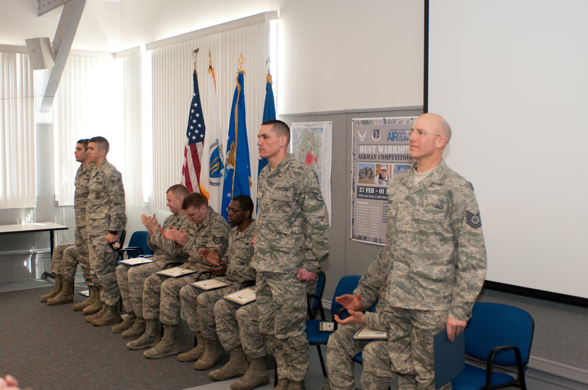 From the left: Airman First Class Christopher Benson, Senior Airman Daniel Miller, Staff Sgt. John Connolly, and Tech. Sgt. Valdemar Johnson step forward as the top four competitors of the Best Airman Warrior competition on Joint Base Cape Cod, March 1, 2014. All four will go on to the Best Warrior competition, later this year, which includes both Mass. Air and Army guardsmen. (National Guard photo by Staff Sgt. Jeremy Bowcock/Released)