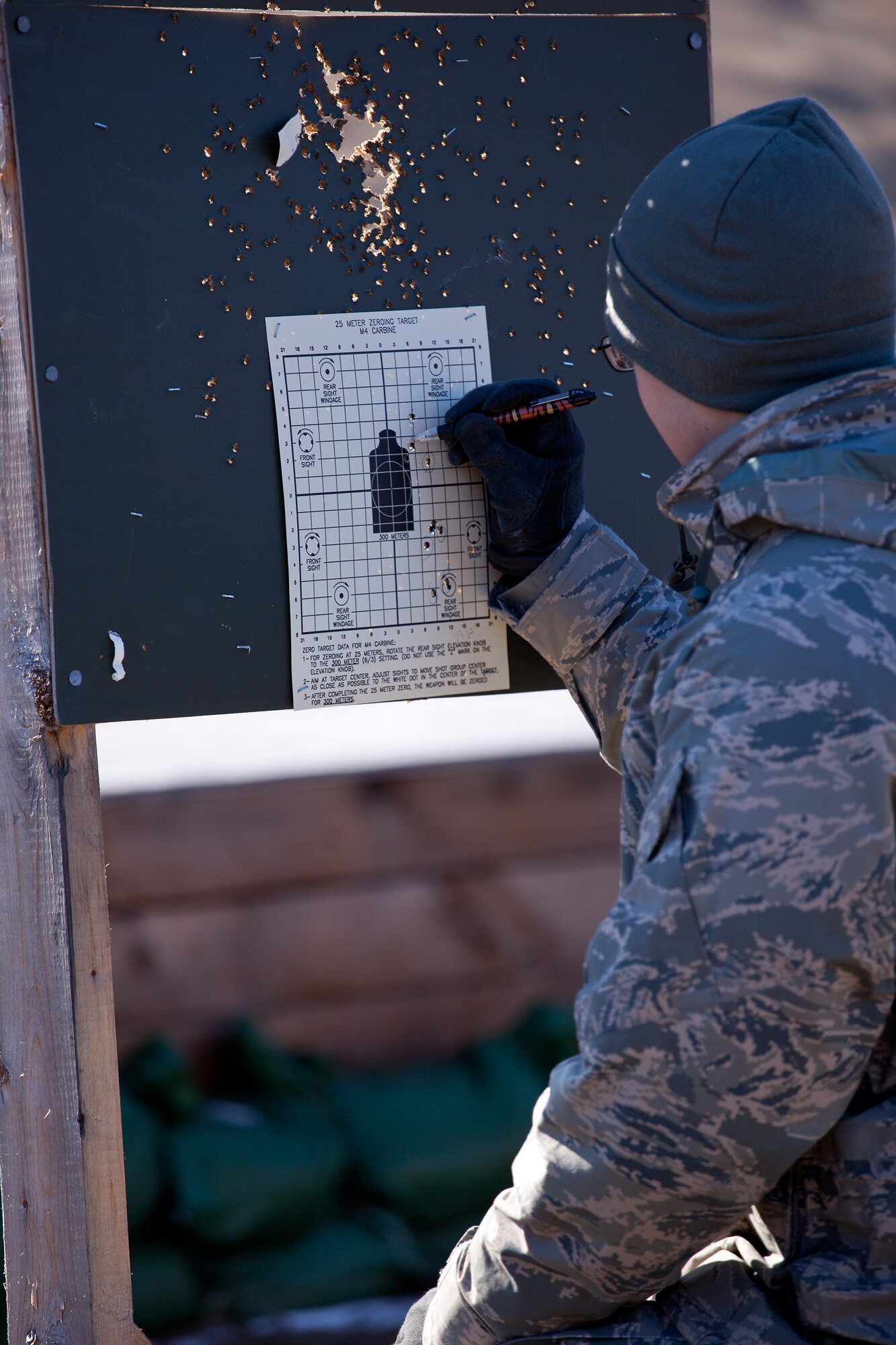Airmen from the 102nd Intelligence Wing and the 104th Fighter Wing compete in the Best Airman Warrior competition on Joint Base Cape Cod, February 28, 2014. The competition tested Airmen in areas like shooting, land navigation, and physical fitness. (National Guard photo by Staff Sgt. Jeremy Bowcock/Released)
