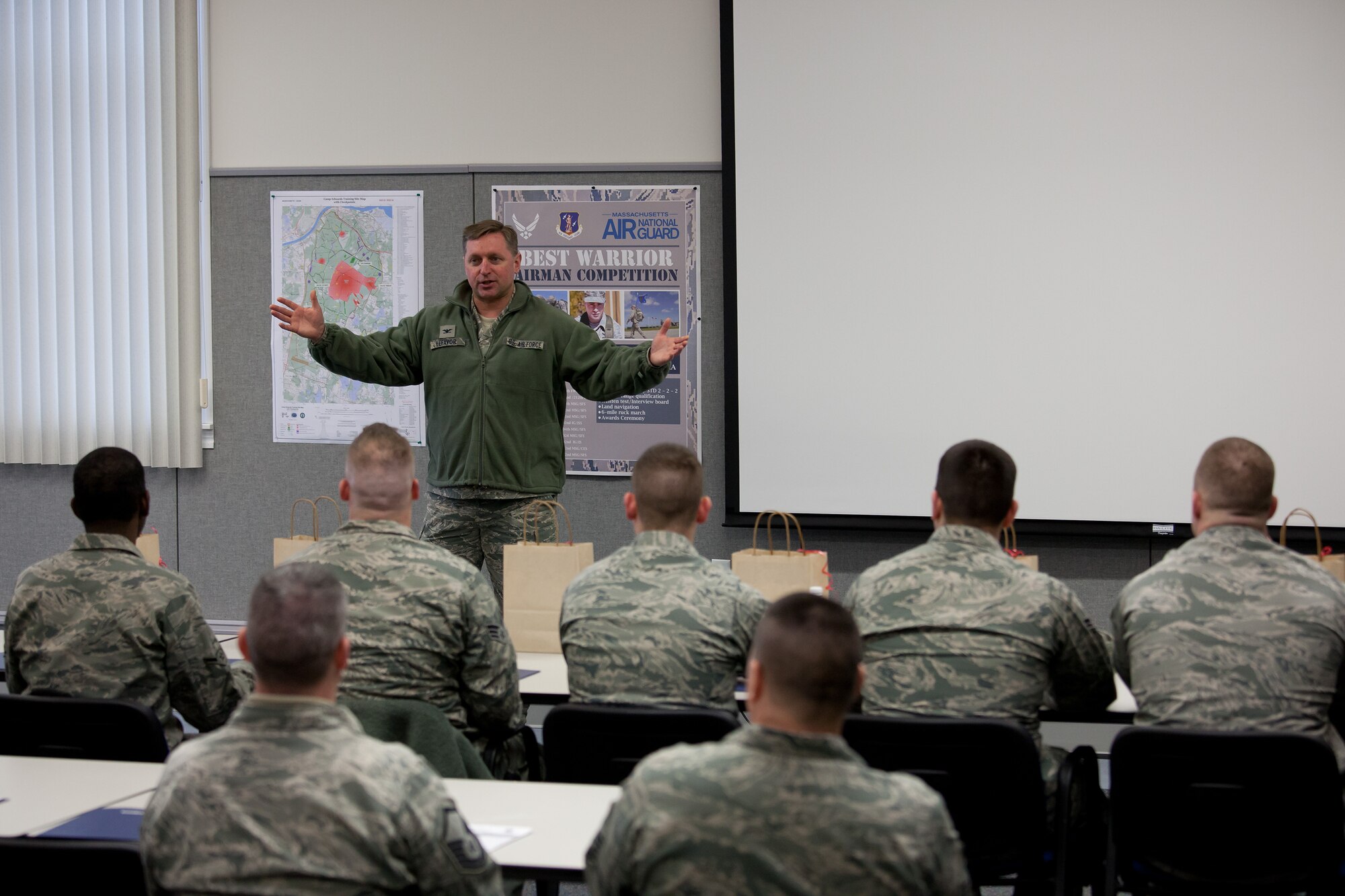 Colonel James LeFavor, commander of the 102nd Intelligence Wing, addresses Airmen from the 102nd IW and the 104th Fighter Wing who are taking part in the Best Airman Warrior competition on Joint Base Cape Cod, February 27, 2014. The competition tested Airmen in areas like shooting, land navigation, and physical fitness. (National Guard photo by Staff Sgt. Jeremy Bowcock/Released)